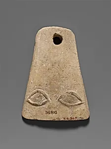 Limestone plaque with two eyes in relief