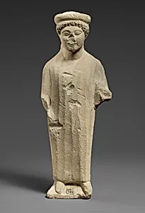 Limestone statuette of a boy with a flat headdress by Unknown Artist