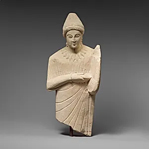 Limestone statuette of a female lyre player