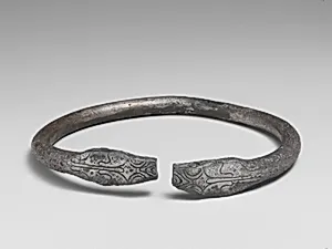 Pair of silver bracelets ending in snake's heads
