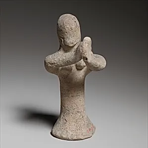 Standing female tambourine player