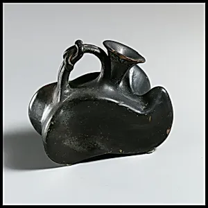 Terracotta askos (flask with a spout and handle over the top)