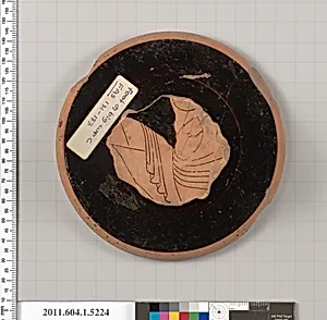 Terracotta fragment of a kylix (drinking cup)