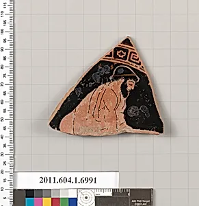 Terracotta fragment of a kylix (drinking cup)