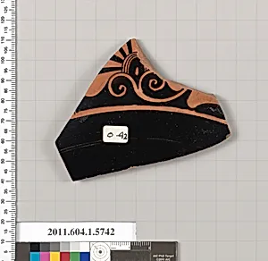 Terracotta fragment of a kylix: eye-cup (drinking cup)