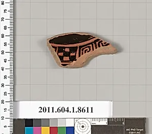 Terracotta fragment of a stemless kylix (drinking cup)