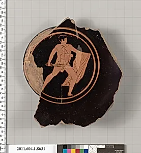 Terracotta fragment of a stemless kylix (drinking cup)