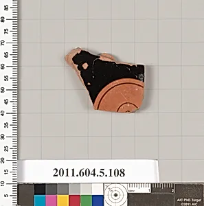 Terracotta fragment of a stemless kylix (drinking cup)