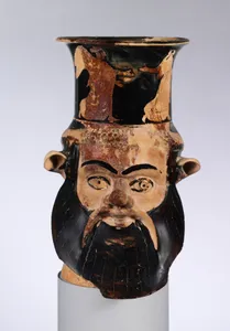 Terracotta mug in the form of a satyr's head