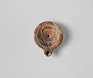 Terracotta oil lamp