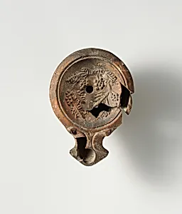 Terracotta oil lamp