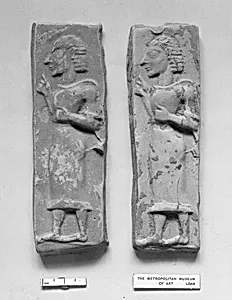 Terracotta plaque with a striding male figure by Unknown Artist