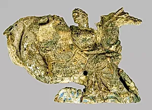 Terracotta relief of a nereid carrying a cuirass