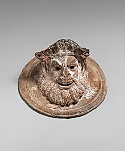 Terracotta roundel with mask of Pan