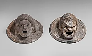 Terracotta roundels in the form of theatrical masks