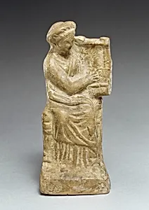 Terracotta statuette of a seated woman playing a kithera