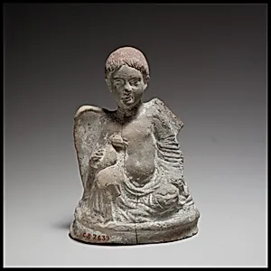 Terracotta statuette of Eros seated and holding a duck