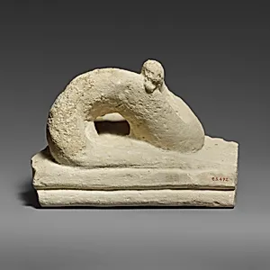 Two fragments of a limestone sarcophagus lid with snakes