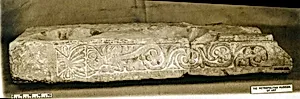 Fragment of a Stand for Water Jars Carved with a Vase and Vegetal Scroll
