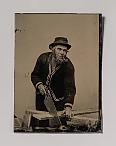 [Carpenter Sawing a Plank of Wood] by Unknown