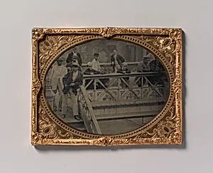 [Group of Men and Boys Standing Along the Railing of the Fulton Street Bridge] by Unknown