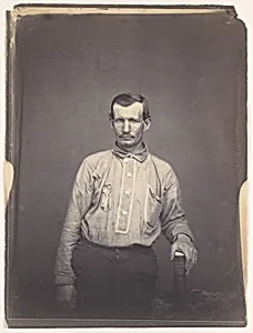 [Man Holding Patent Office Book]