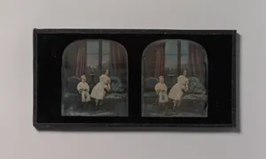 [Stereograph, Two Children Standing Between Furniture in a Studio Parlor Setting]