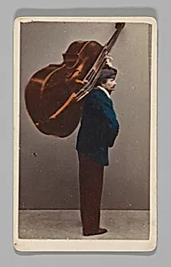 [Studio Portrait: Man Carrying Cello or Large Stringed Instrument, Venice] by Carlo Ponti