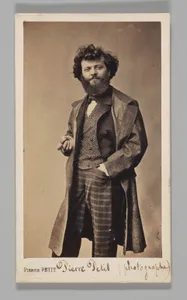 [Studio Portrait: Self-Portrait Wearing Plaid Pants and Overcoat]