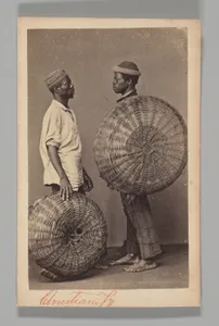 [Studio Portrait: Two Male Street Vendors in Profile with Baskets, Brazil]