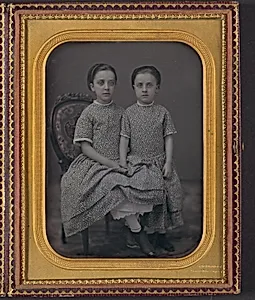 [Two Girls in Identical Dresses]