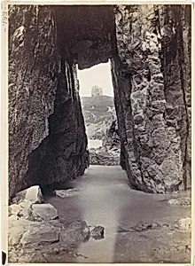 [View Through Rocks' Of Tower On Hill]