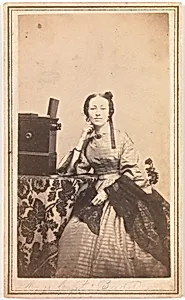 [Young Woman with Beckers Tabletop Stereoscope] by Porter Photograph Parlors
