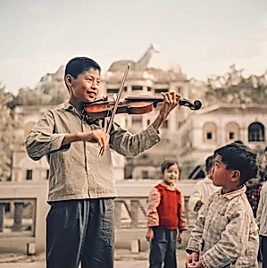 A Boy Playing the Violin in Gulangyu Island, Xiamen Province