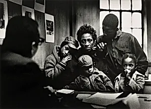 At the Poverty Board: Bessie and Kenneth, Little Richard, Norman Jr., and Ellen