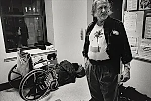 Boston (As the temperature drops, Linda and Gerald reluctantly spend the night at a shelter, rather than on the streets. This emergency facility, which will admit people who are drunk, is sometimes referred to on the street as the "Nightmare Center" or "Fright Center." There are no beds, so guests must sleep on chairs or on the floor. Linda sleeps under her wheelchair because she worries that someone might steal it.)