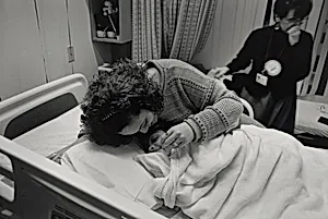 Boston (Sharon Morrison, a nurse with the Family Team at Boston Health Care for the Homeless Program, has a special fondness and respect for this young mother and her daughter. She marvels at the calm and loving manner of the mother and the corresponding spirit of joy and playfulness in her child. The little girl is about to undergo emergency brain surgery to replace a shunt.)