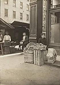 Lena Lochiavo - 11 years old, basket (and pretzel) seller, at Sixth Street Market in front of saloon entrance, Cincinnati, Ohio