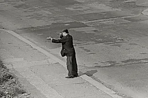 Man Gesturing in the Street