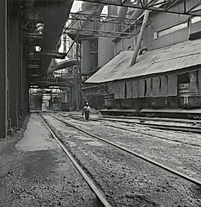 Man Inspecting Railroad Tracks beneath Blast Furnaces, Inland Steel Company, East Chicago, Indiana