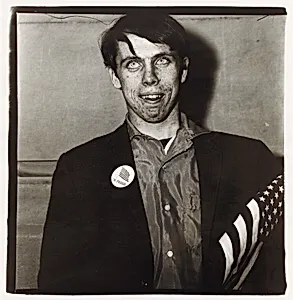 Patriotic young man with a flag, N.Y.C. 1967
