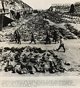 Title from caption on object: “Bodies of Slave Laborers Await Burial at German Camp”