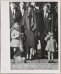 Title from caption on object: "John Jr. Salutes Casket"