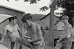 Untitled [Kentucky, Men Fixing Cars]