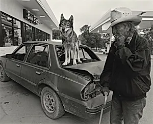Vern Sitting Bear and His Niece's Pet Wolf
