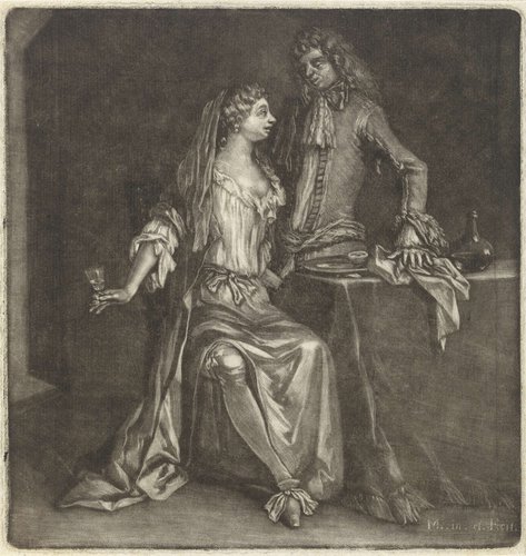 Vrouw en een man bij een tafel