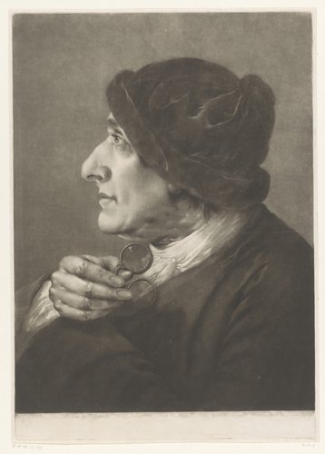 Man met een bril in zijn hand