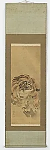 A crouching, snarling tiger