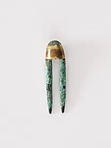 Topknot pin by Unknown