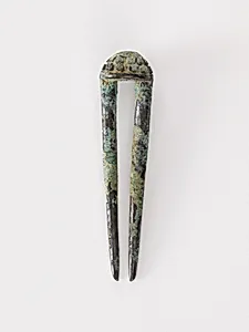 Topknot pin by Unknown